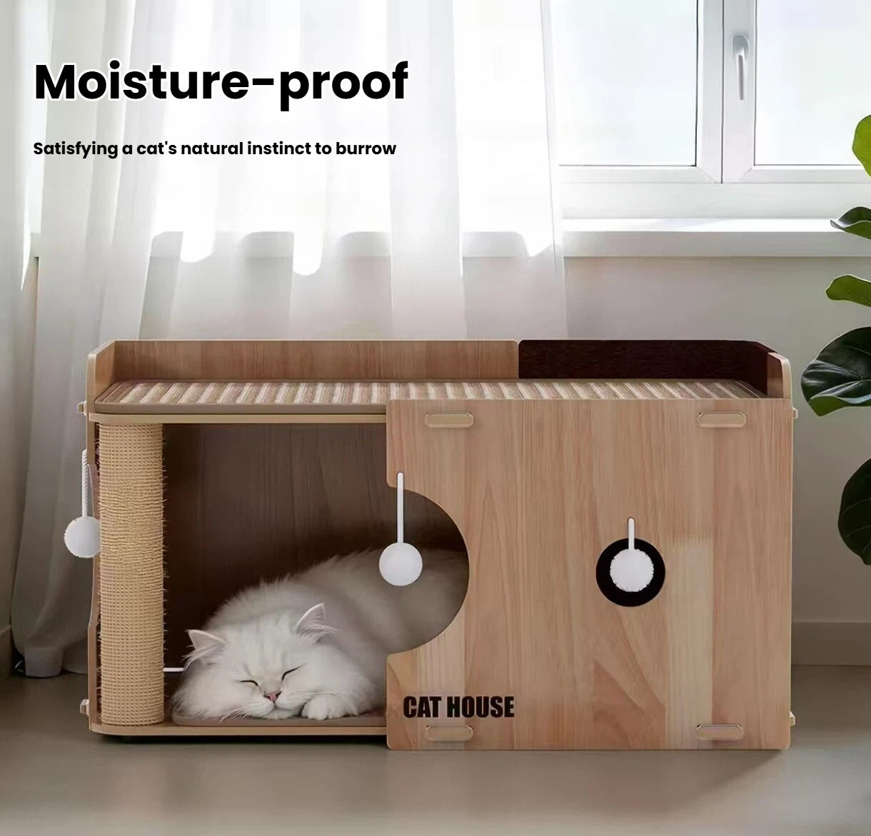 Cat sleeping inside the lower moisture-resistant cat bed compartment