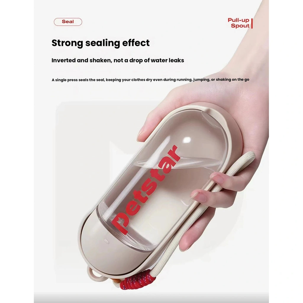 Sealed Petstar pet water bottle held in one hand