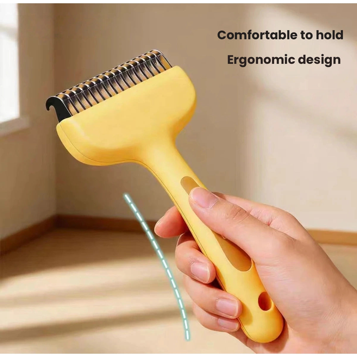 Yellow pet comb handle held during grooming
