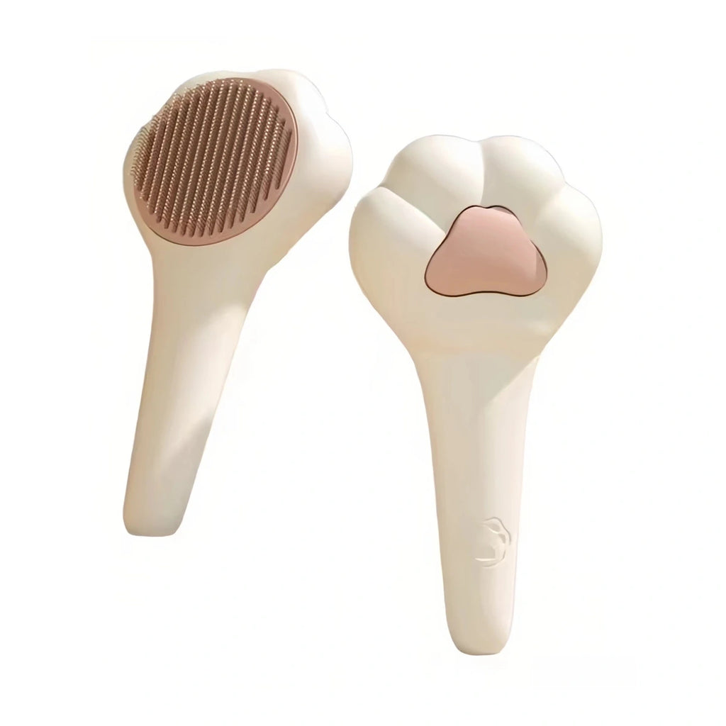 White paw-shaped cat grooming brush