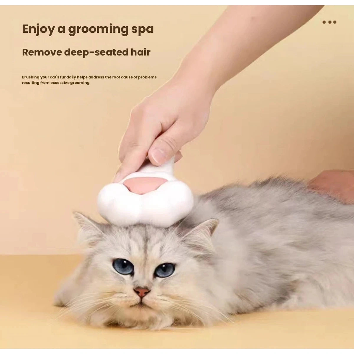 Paw-shaped brush used on a grey cat