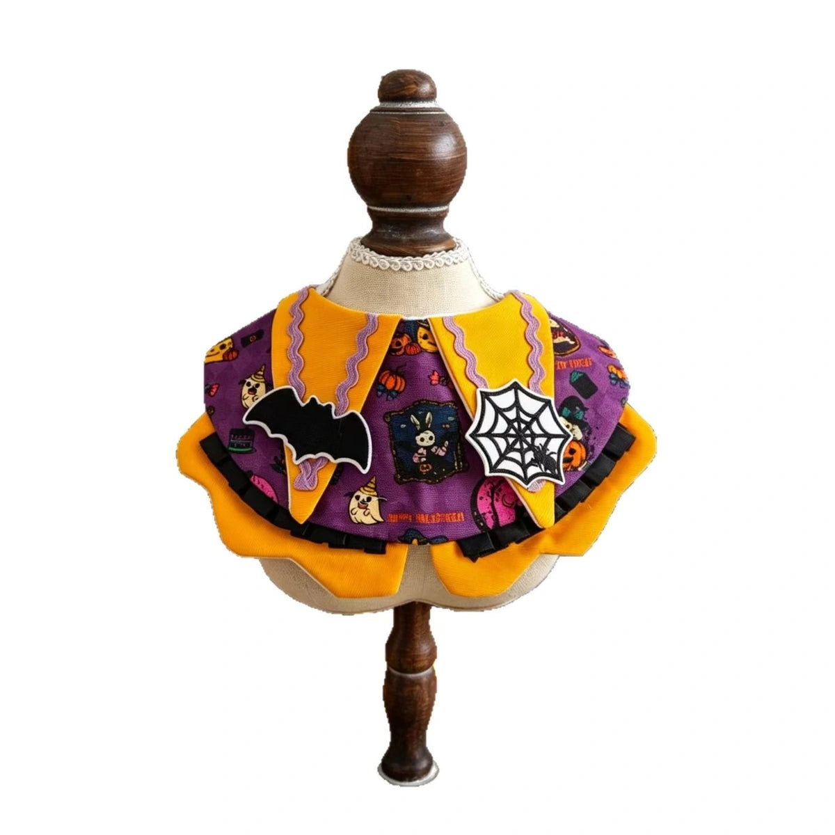 Pumpkin-themed pet bib costume on mannequin