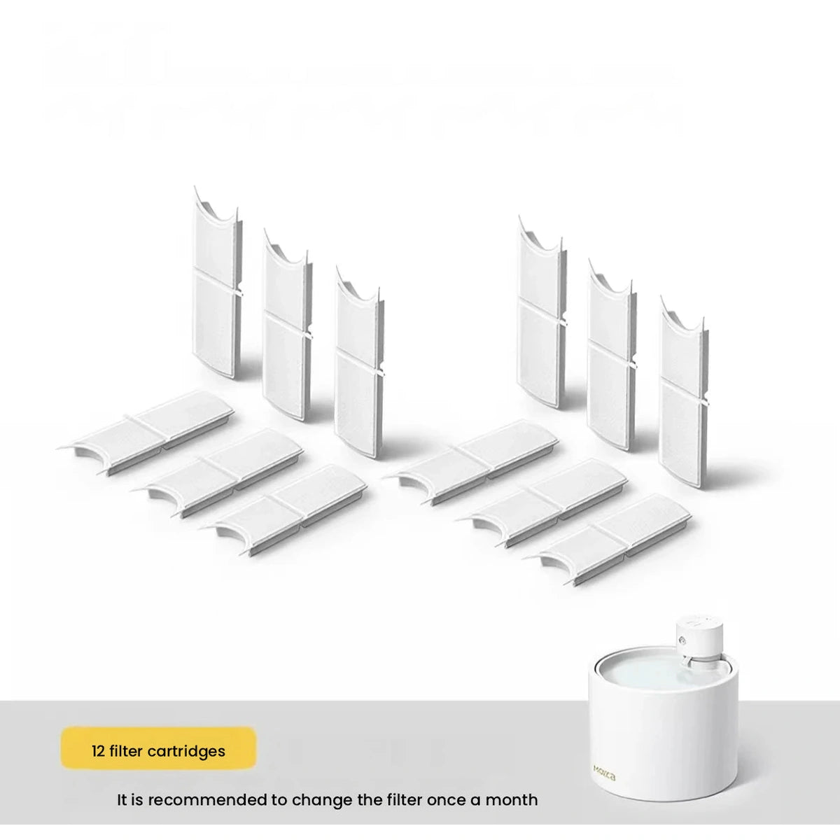 Replacement fountain filter pack and pads beside ceramic bowl