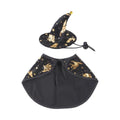 Black witch hat and cape costume pieces laid flat