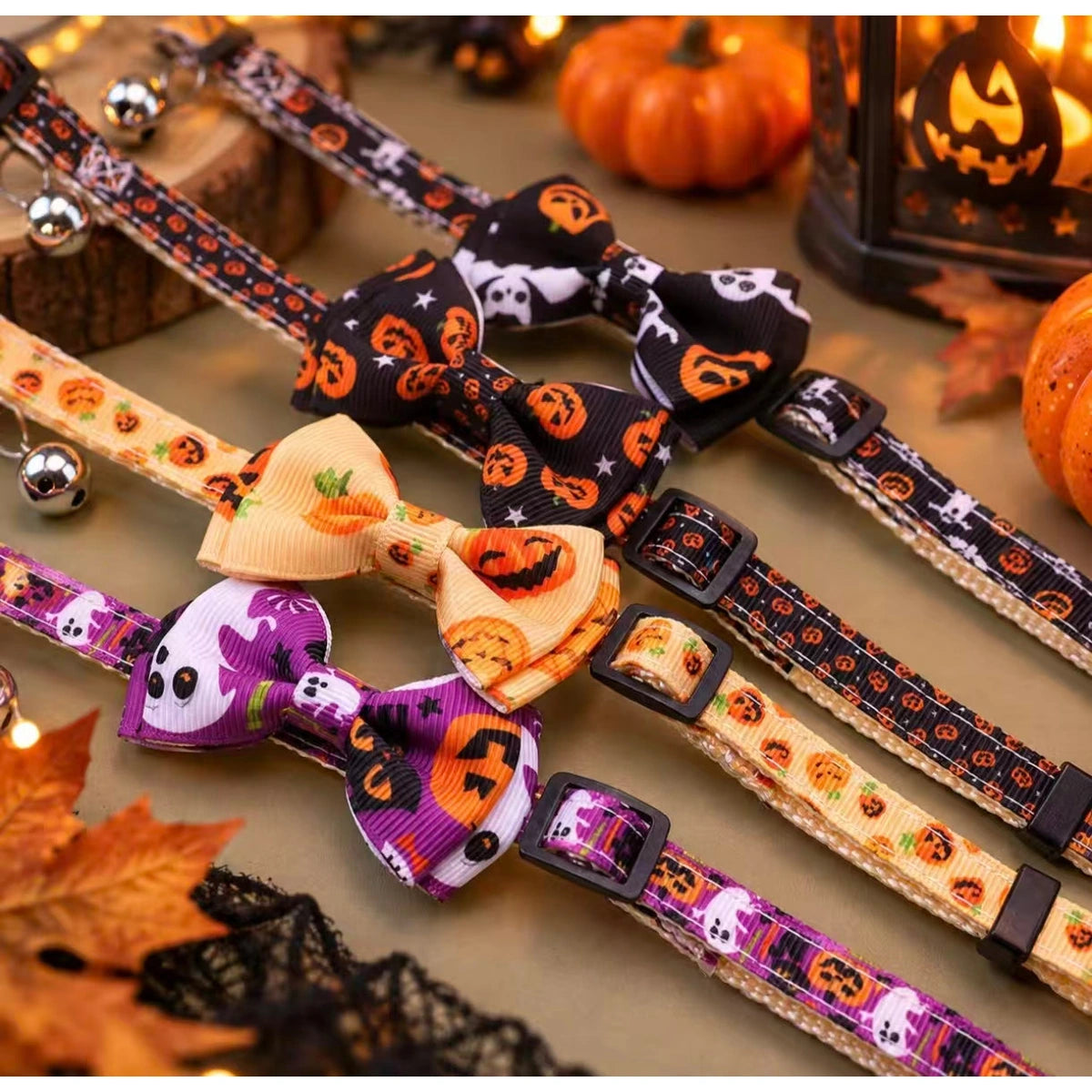 Four Halloween patterned collars laid on autumn display