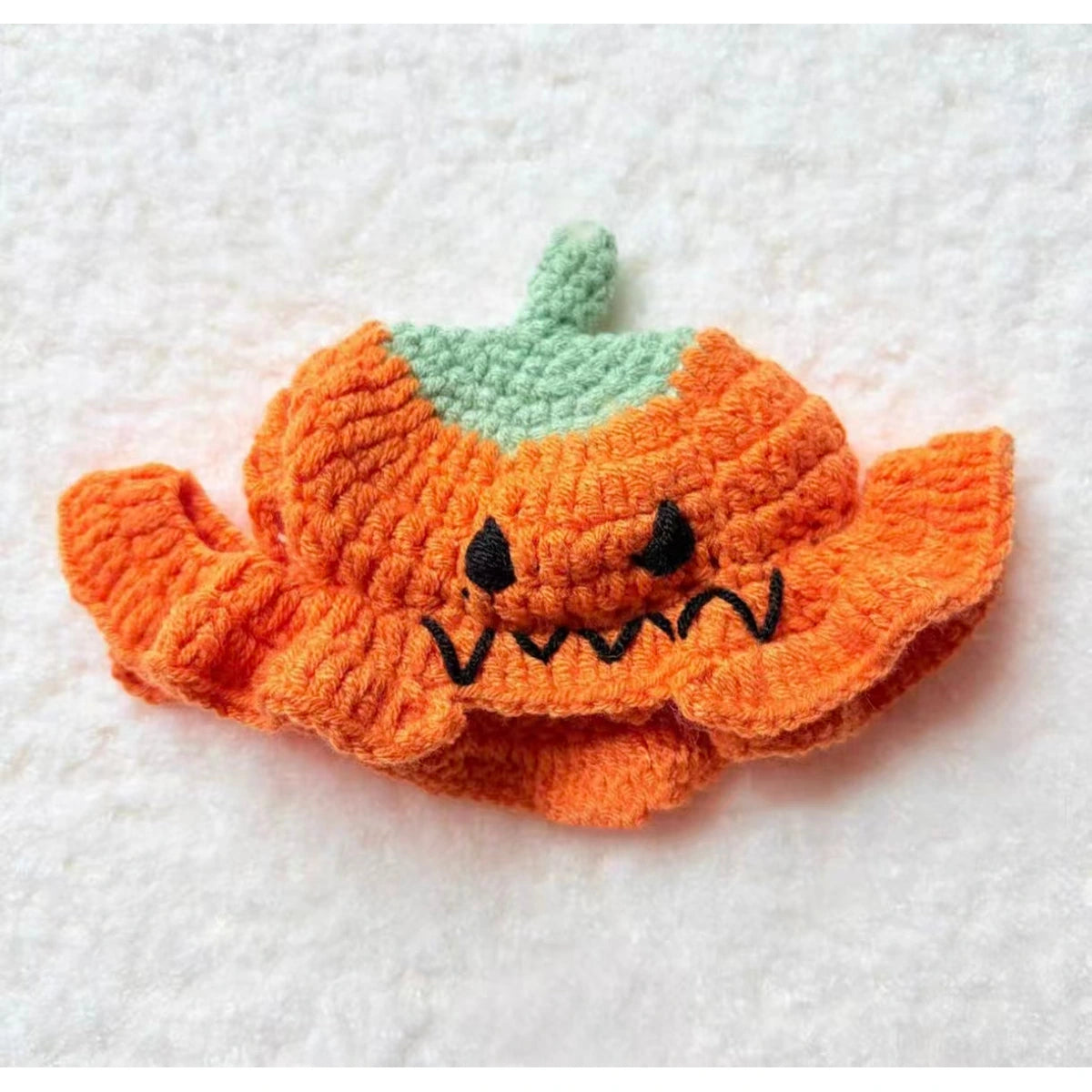 Orange pumpkin knit pet hat close-up