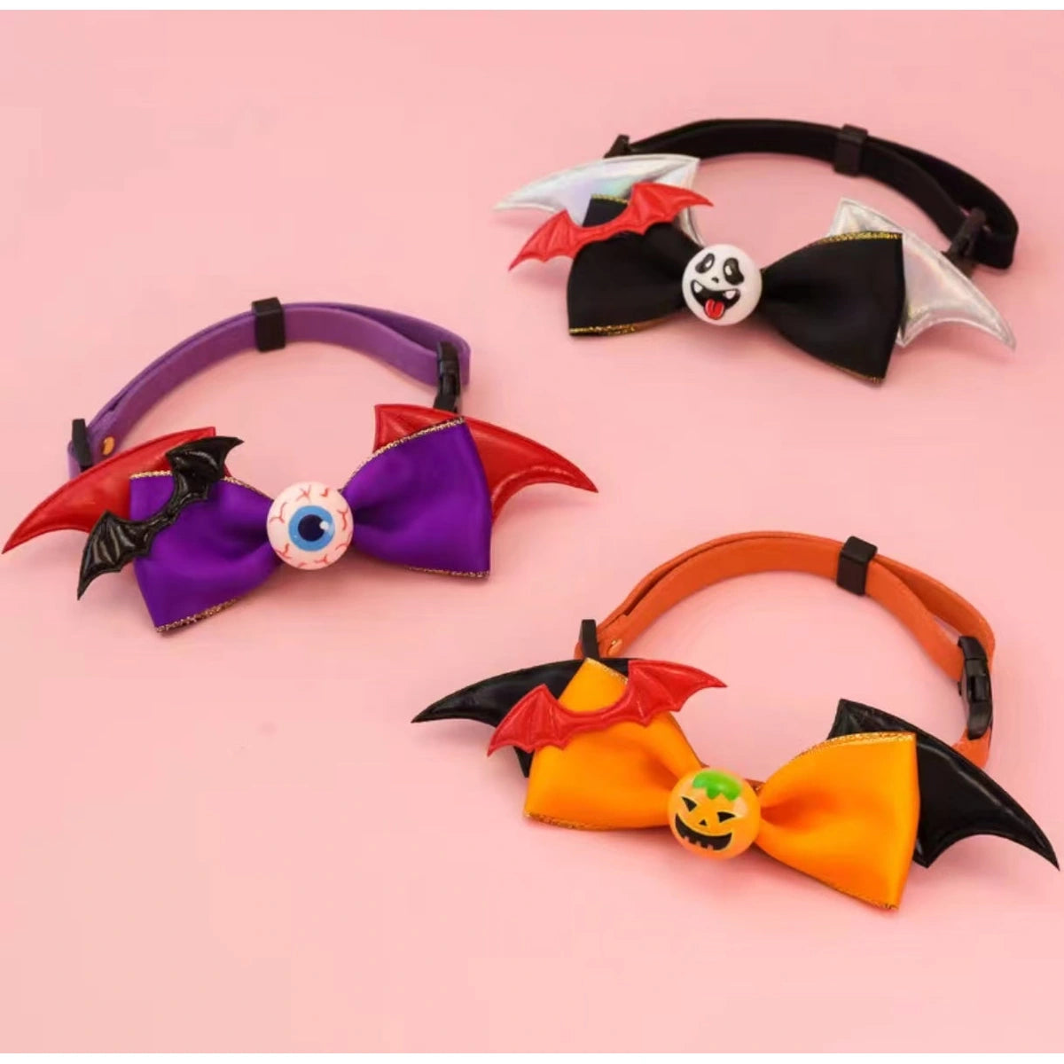 Three Halloween pet bow collars laid flat