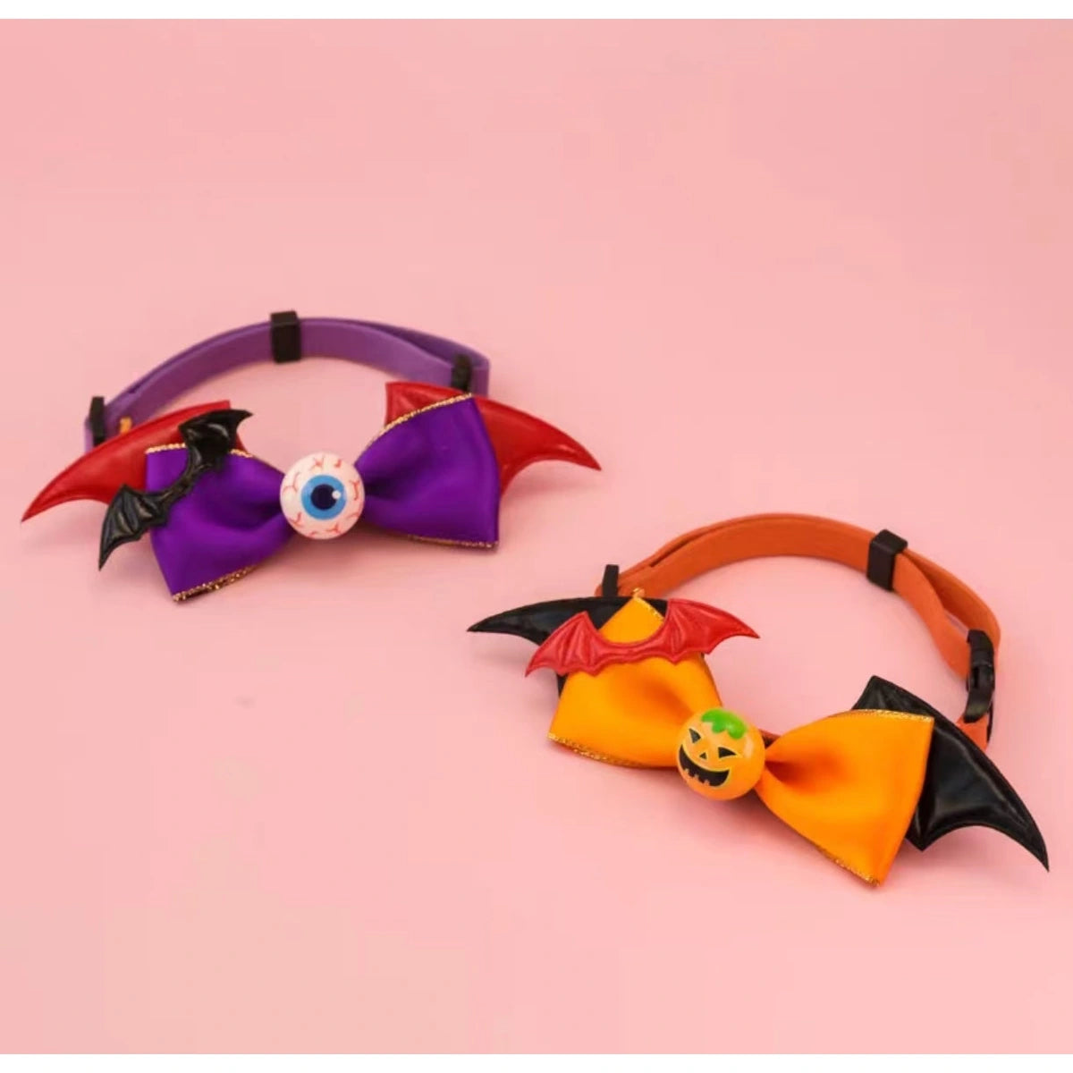 Purple and orange bat bow collars viewed above