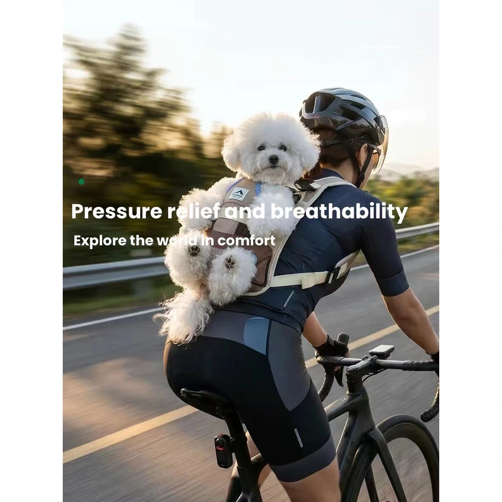 Dog carried in front pet backpack during cycling