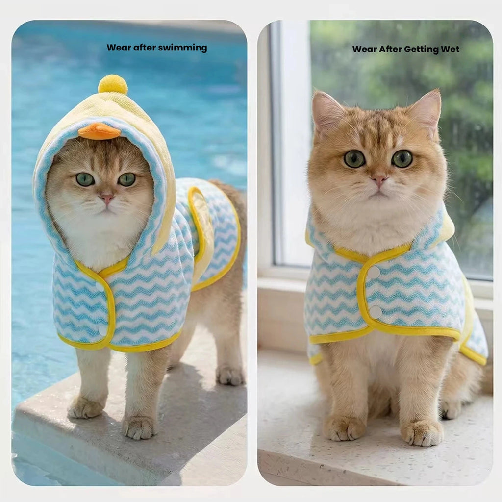 Small dog wearing pink hooded pet bathrobe