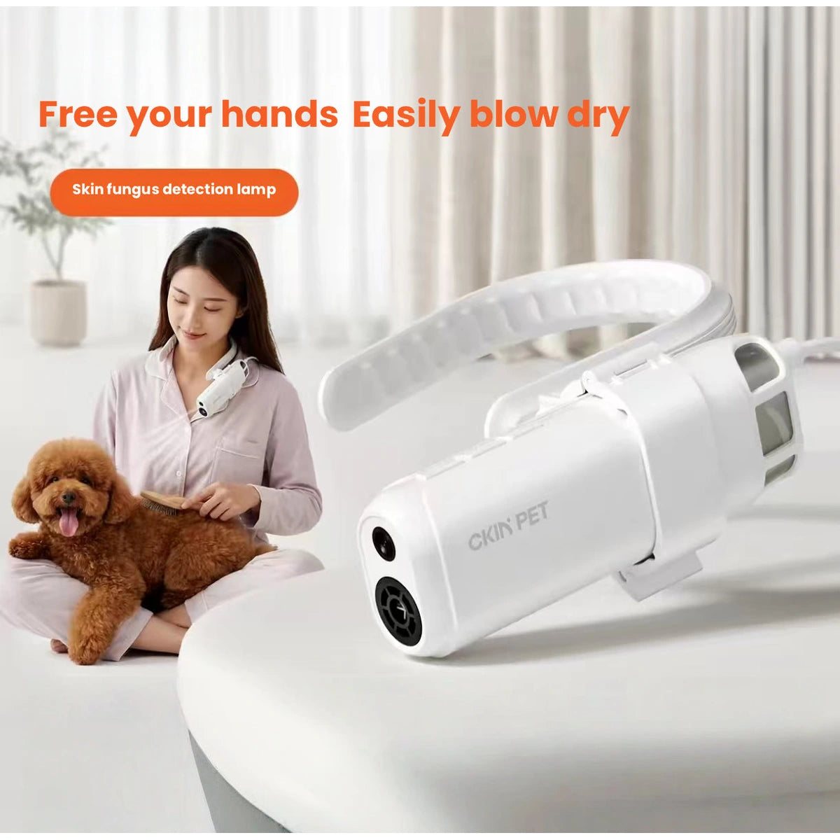 Person using white Ckin Pet dryer while brushing a dog