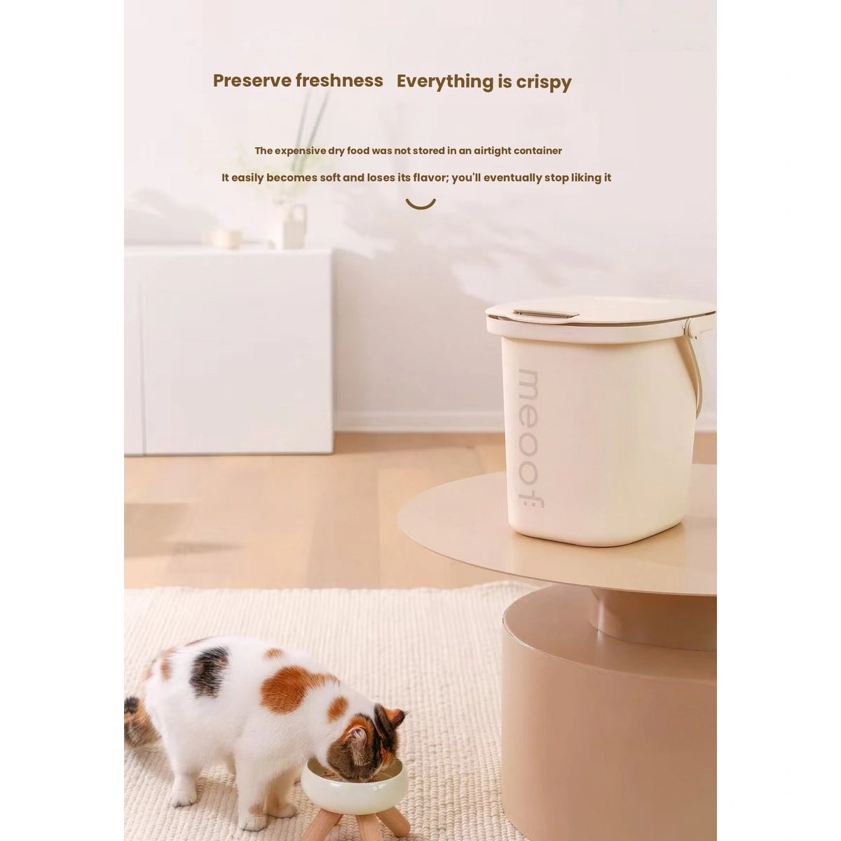 Meoof pet food storage bin pictured beside a cat