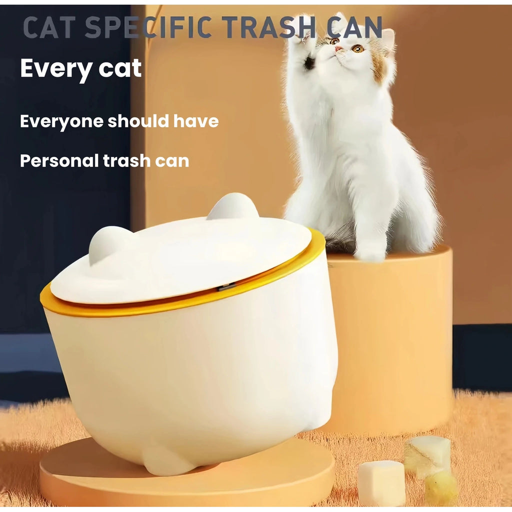 Round cream cat litter waste bin beside a cat