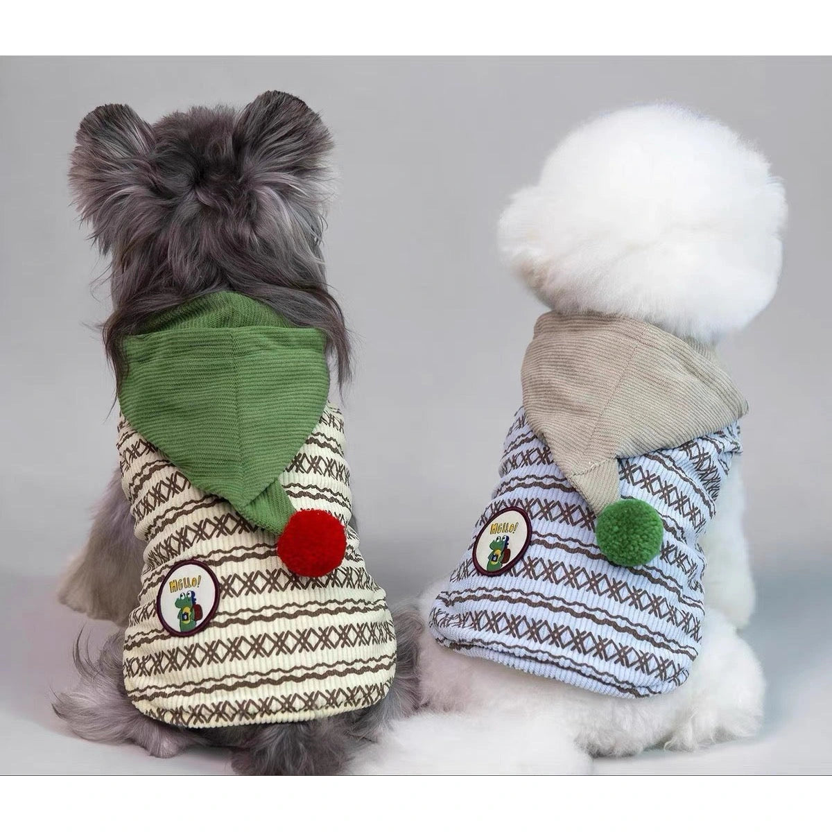 Rear view of dogs in the green and grey POPOCOLA hoodies