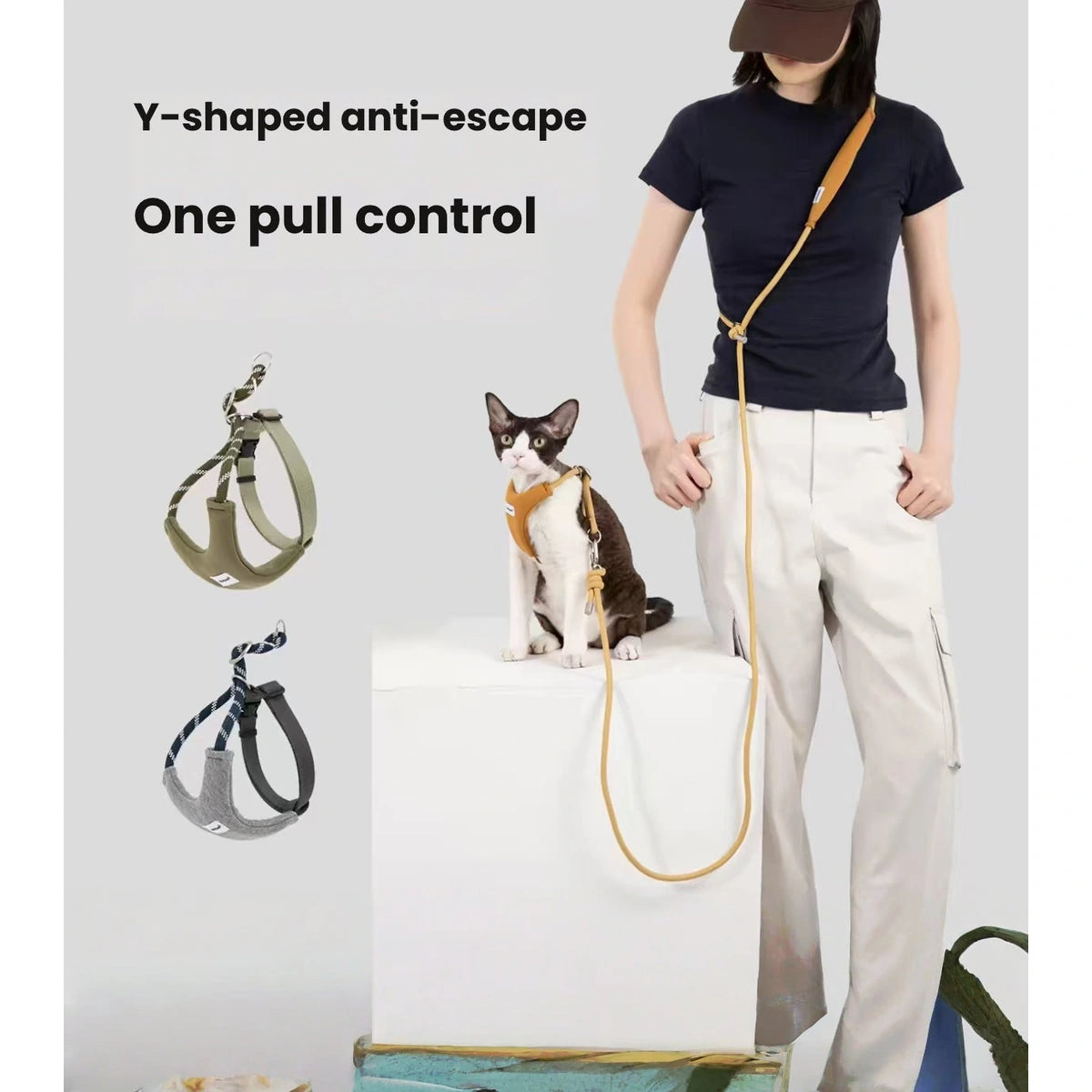 Person holding a cat lead while wearing it across the body