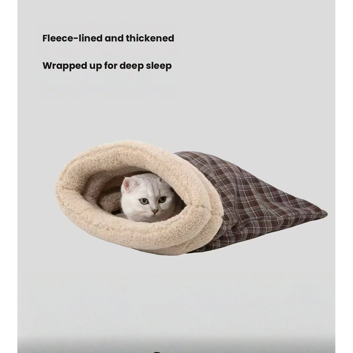 Cat resting in the soft-lined HiDREAM cave bed