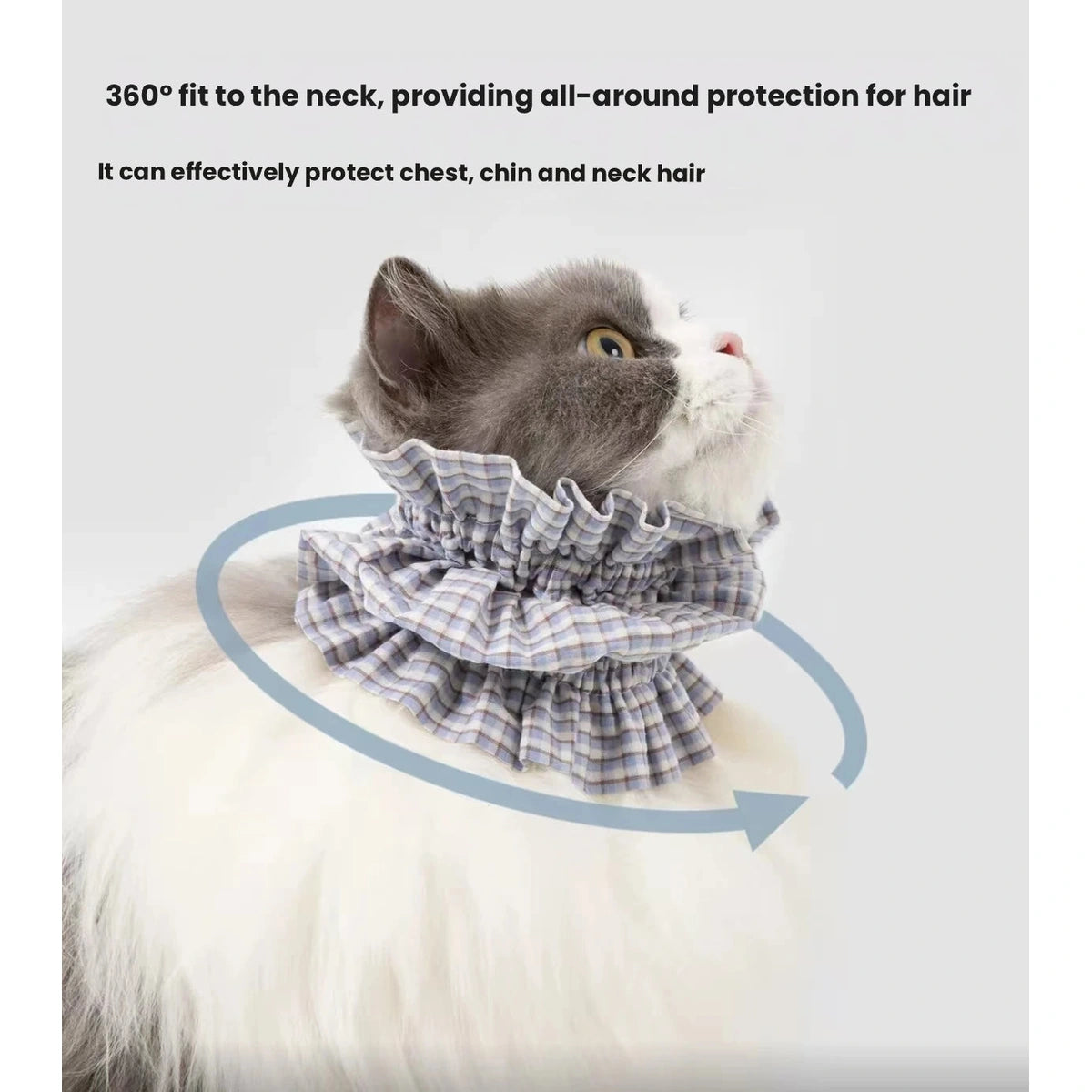 Cat eating while wearing a HiDREAM feeding bib