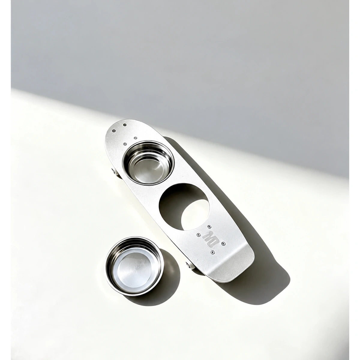 Mies skateboard-style stand with one steel bowl removed