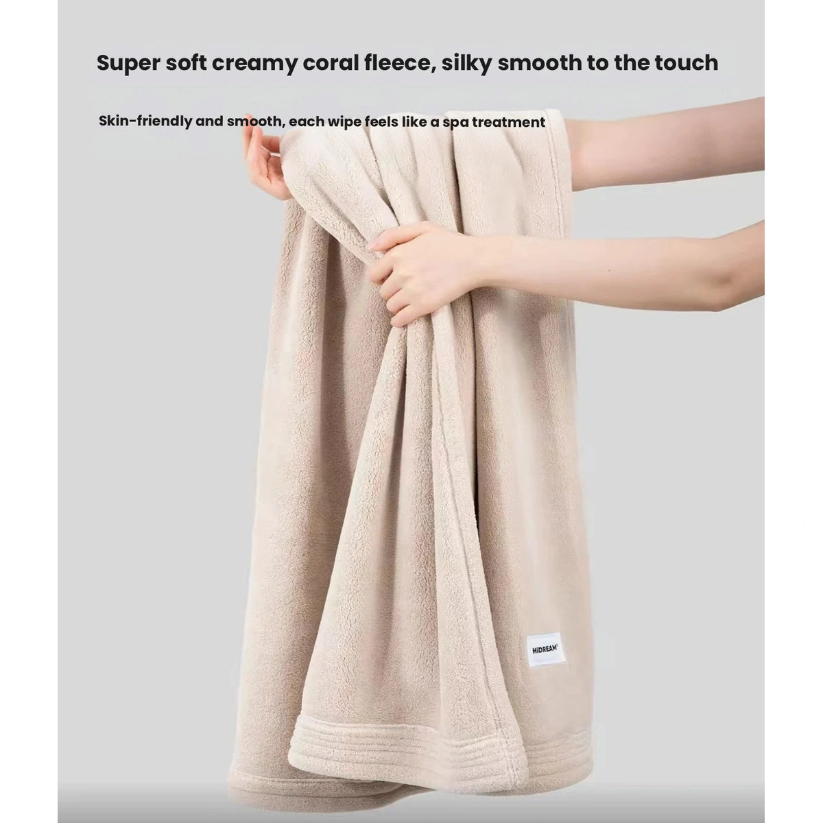 Beige HiDREAM coral fleece pet towel held up to show its plush texture
