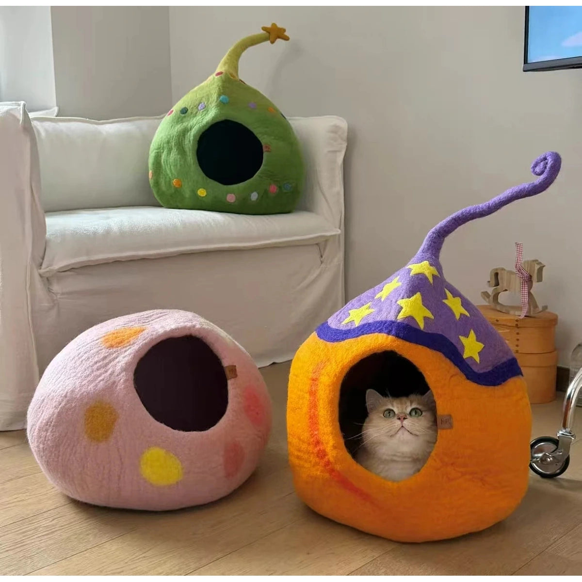 Coni Life round and pointed-top cat cave designs displayed together