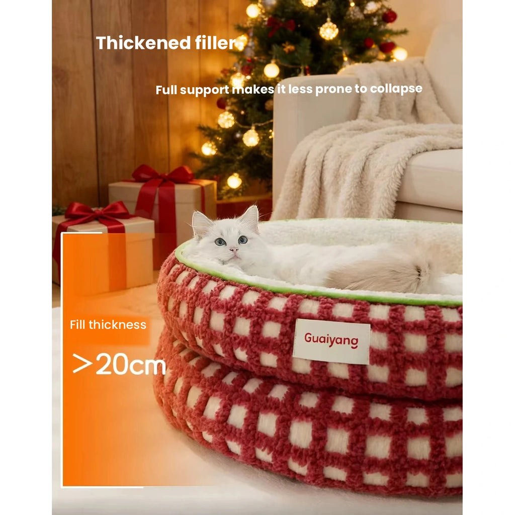 Cat beside the plush raised rim of a red HiDREAM bed
