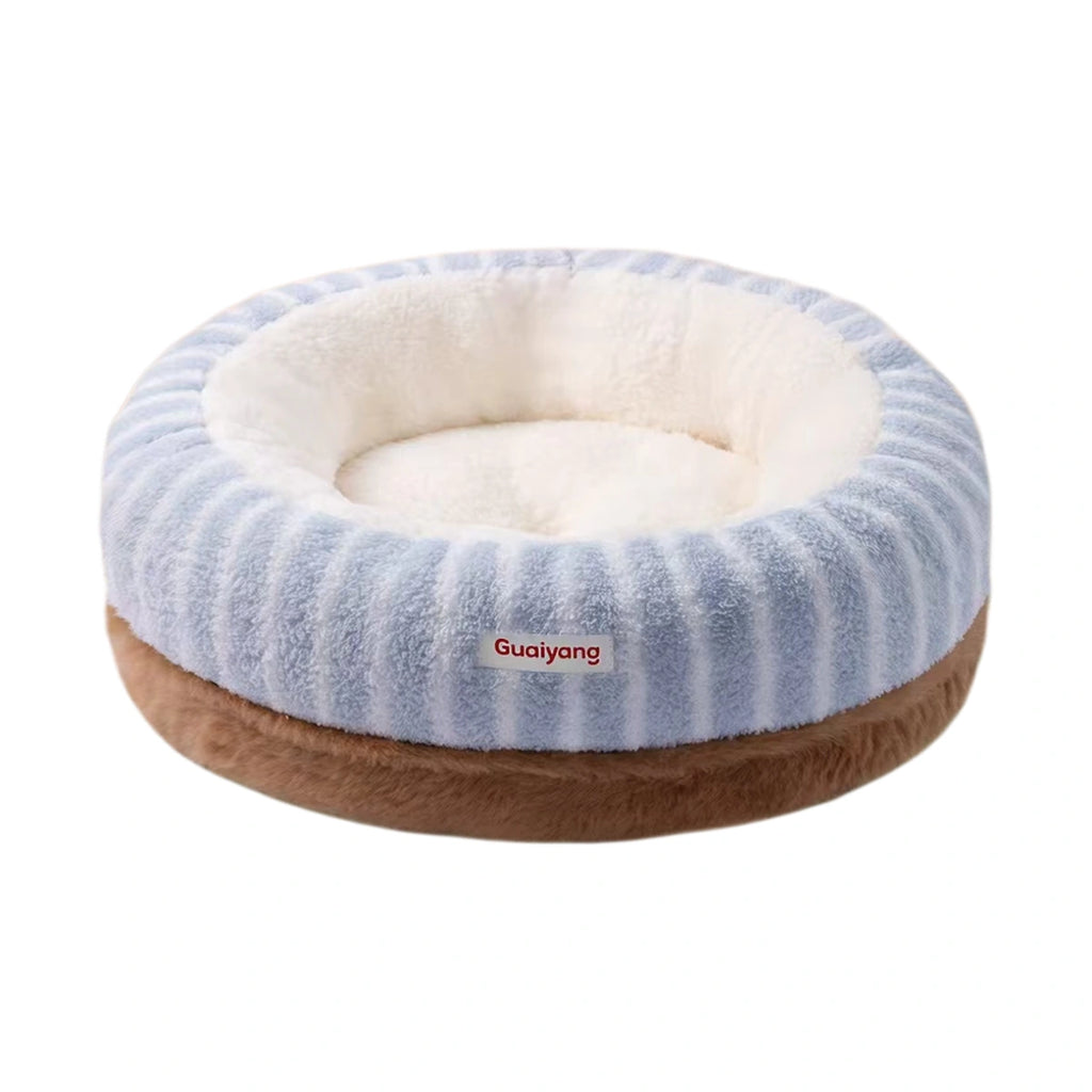 Blue striped round cat bed with a pale plush interior