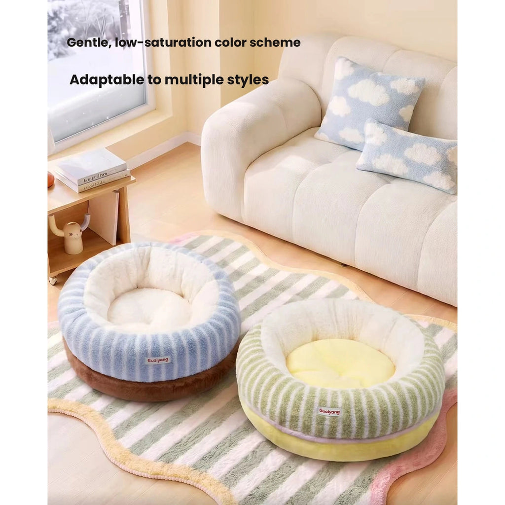 Blue and green round pet beds in a living room