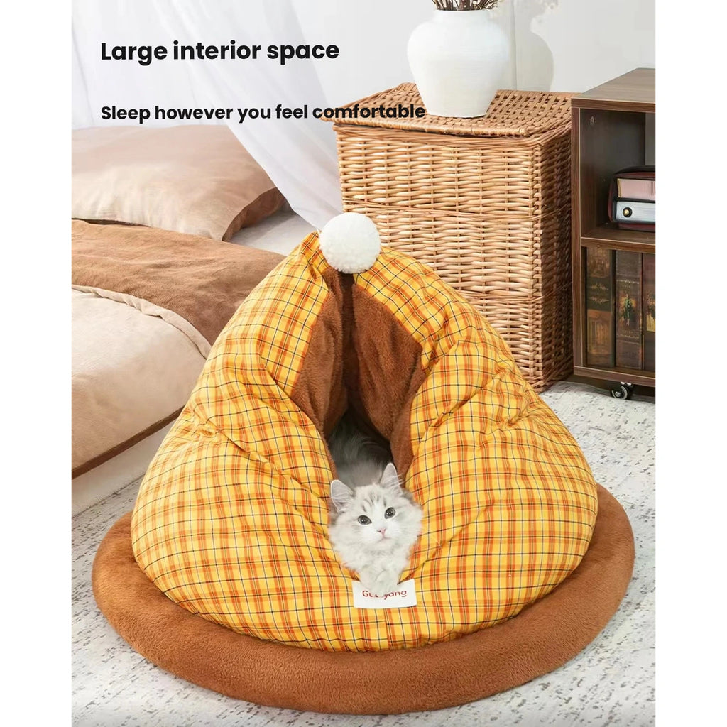 Cat inside the yellow checked cave bed