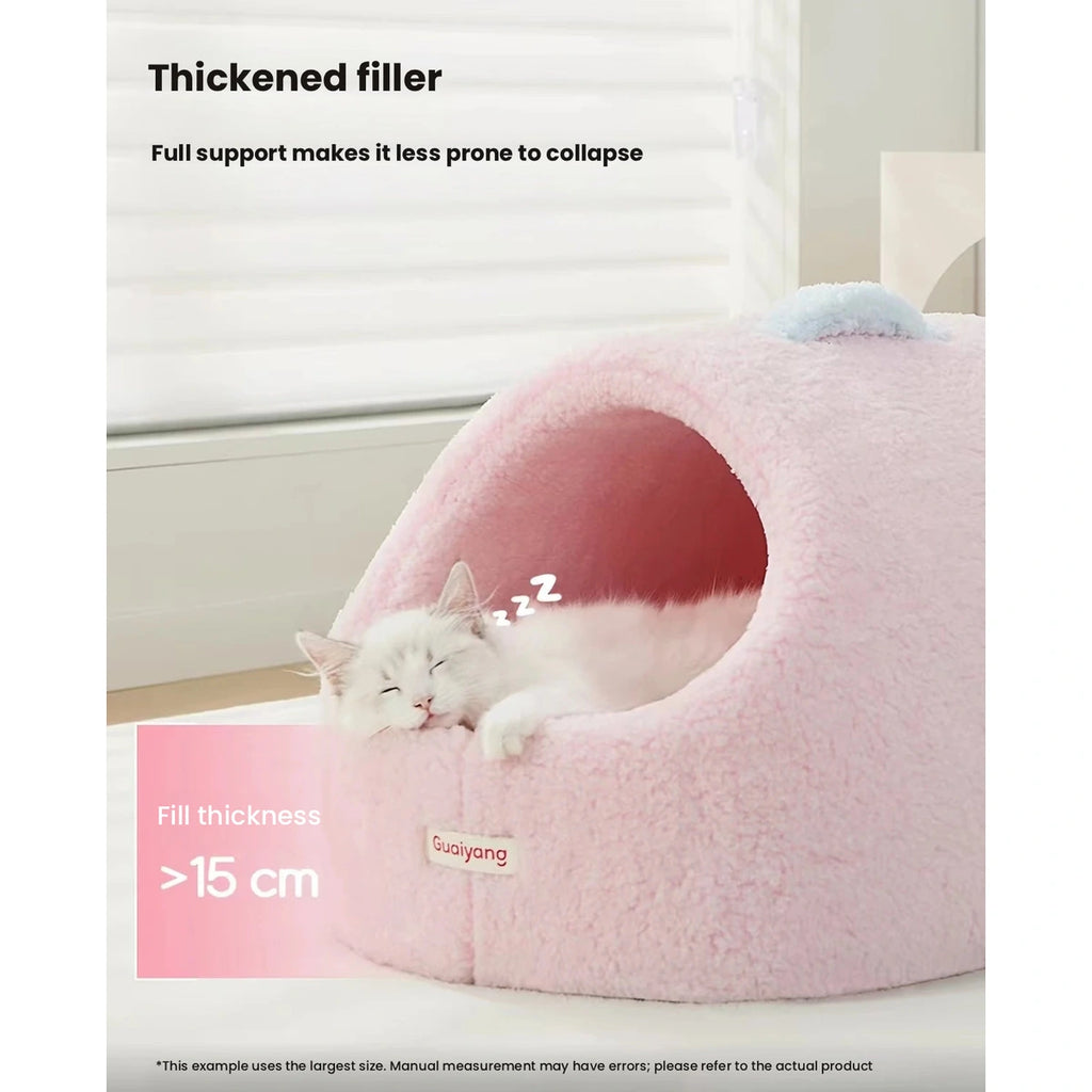 Pink plush cat cave bed with a cutaway illustration of the filling