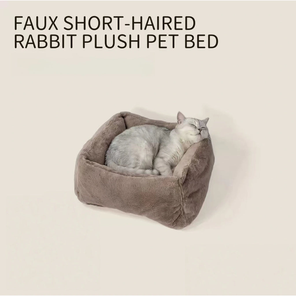 Cat resting inside the inFluffy faux fur bed