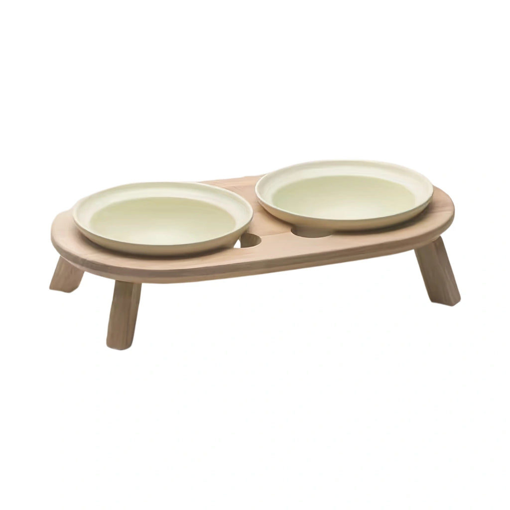 inFluffy wooden feeding stand holding two pale ceramic bowls