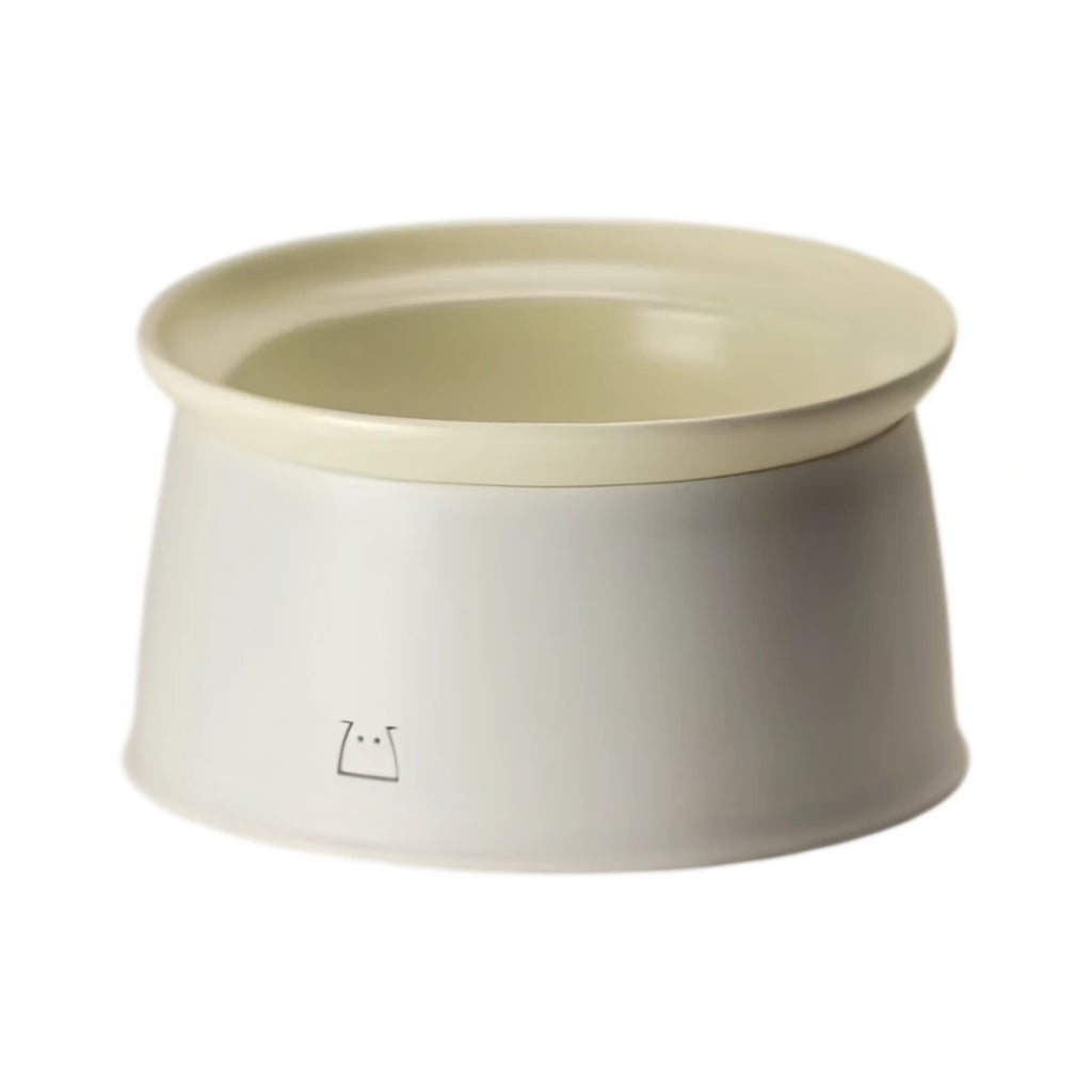 Cream inFluffy raised pet bowl with removable pale insert