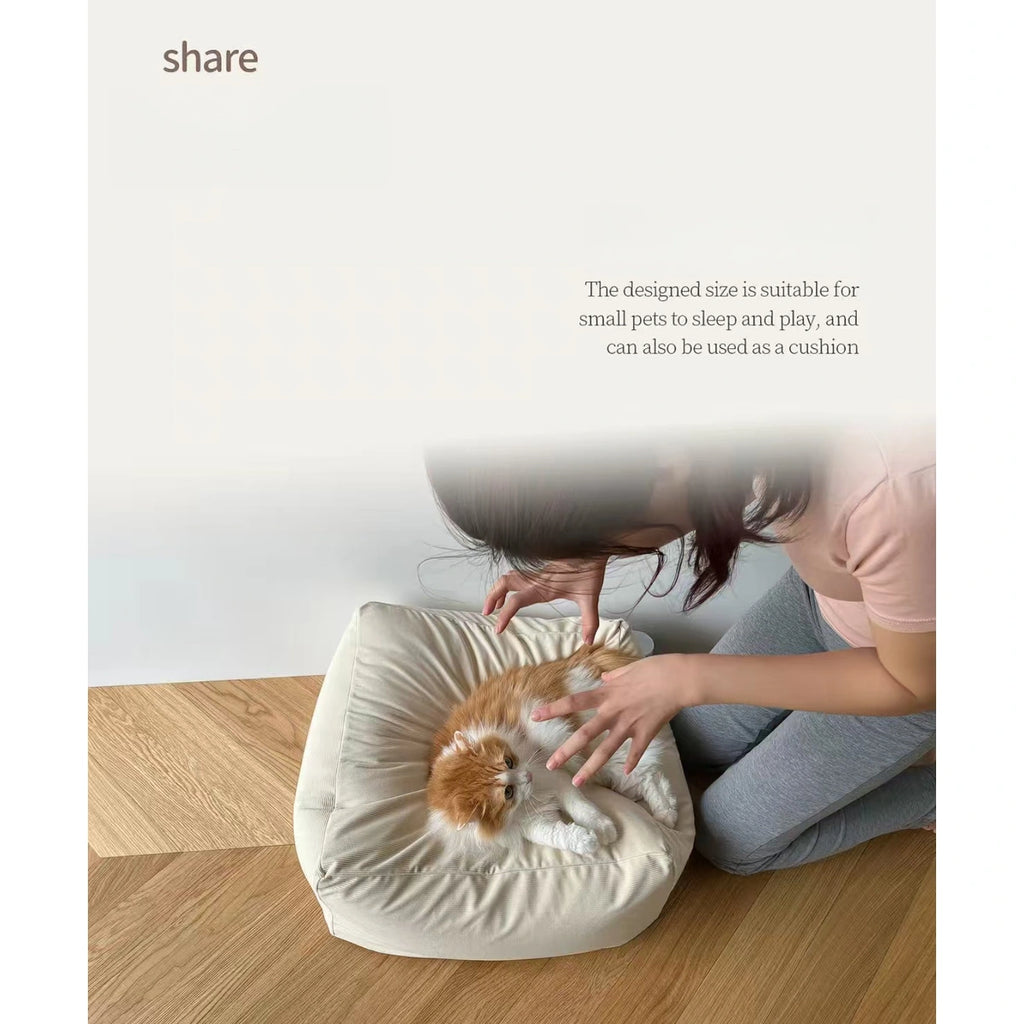 Cat resting on the inFluffy square corduroy cushion