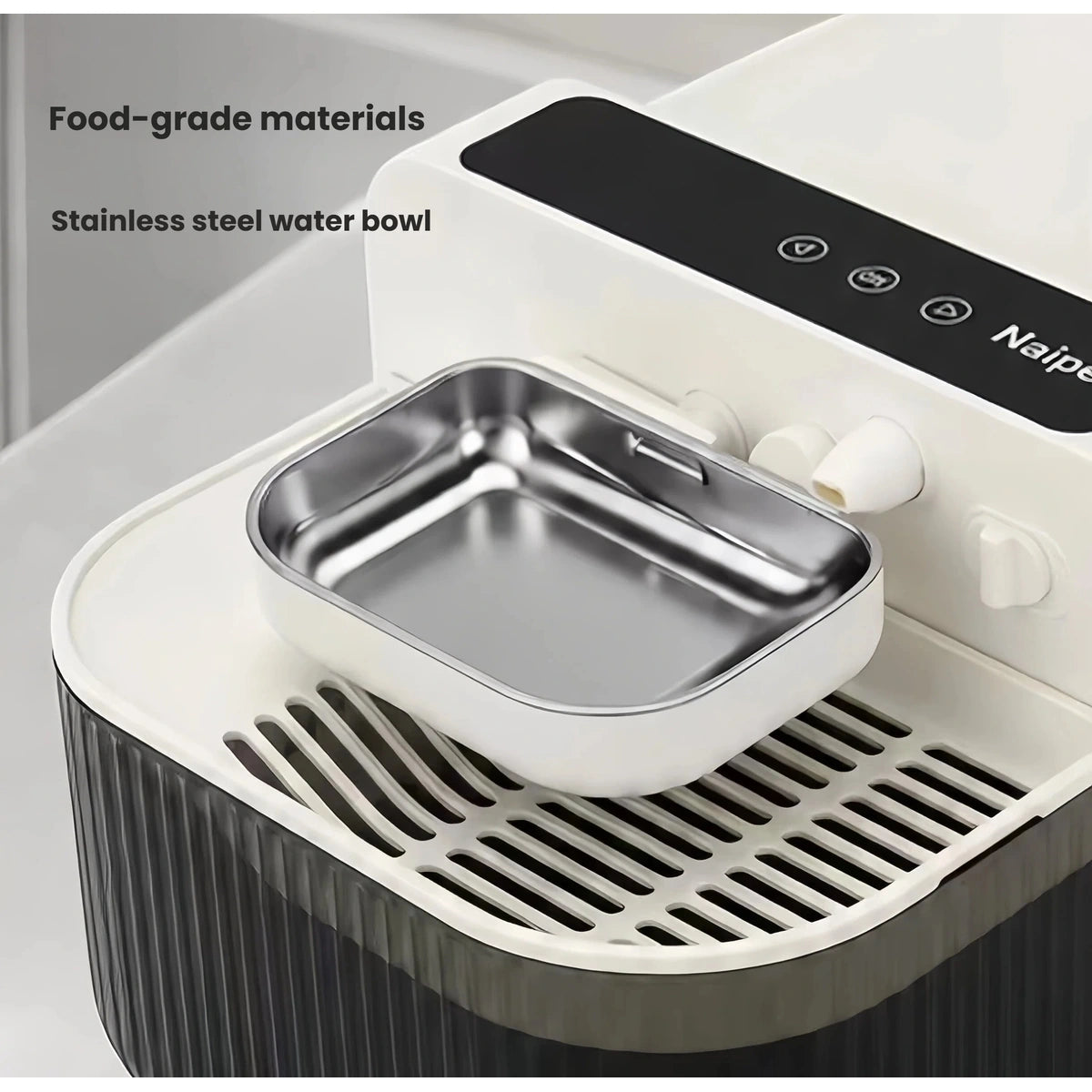 Close-up of the Naipet stainless steel bowl and water outlet