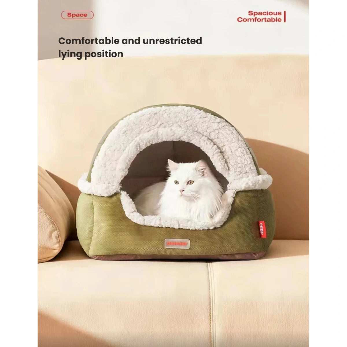 White cat looking out from the cream-lined Petstar cat cave