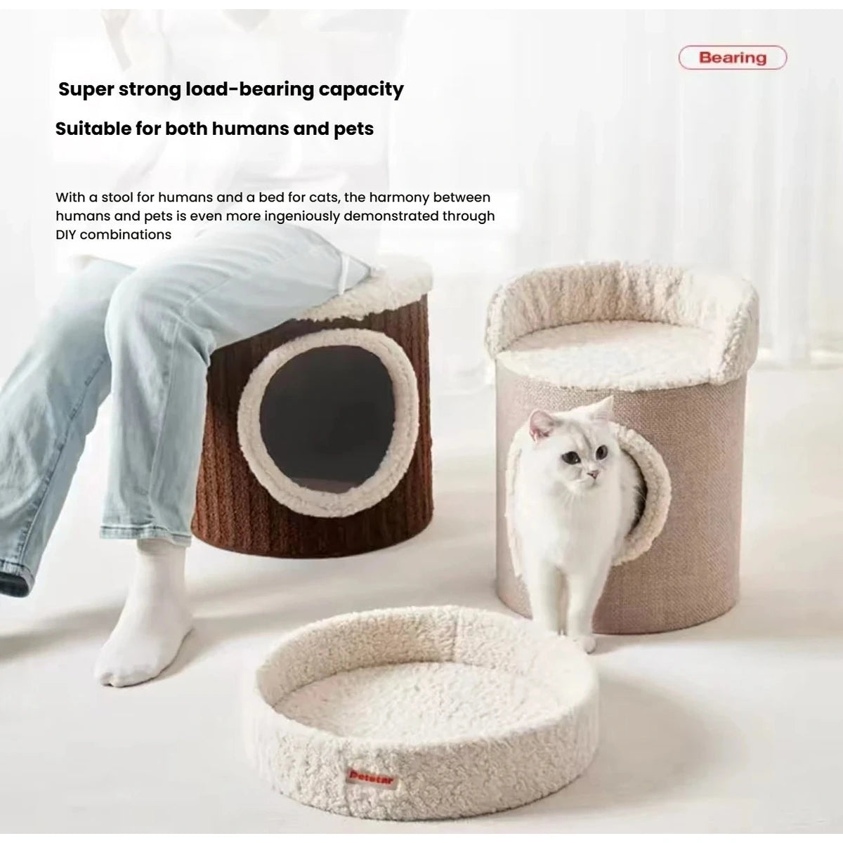Petstar modular cat house sections separated beside a seated person
