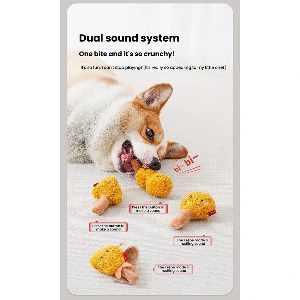 Dog playing with the squeaky fried chicken plush pieces
