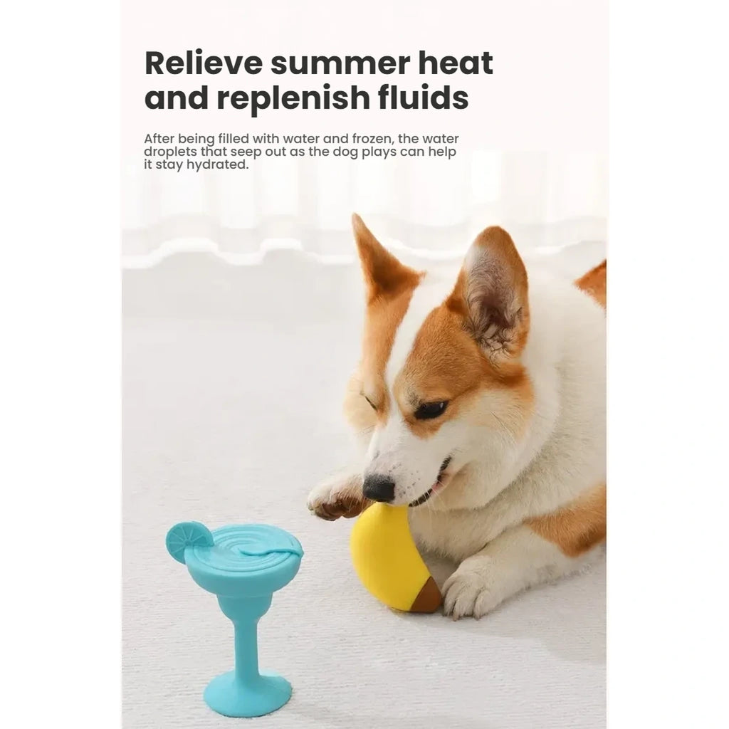 Dog holding the banana-shaped Petstar cooling chew toy