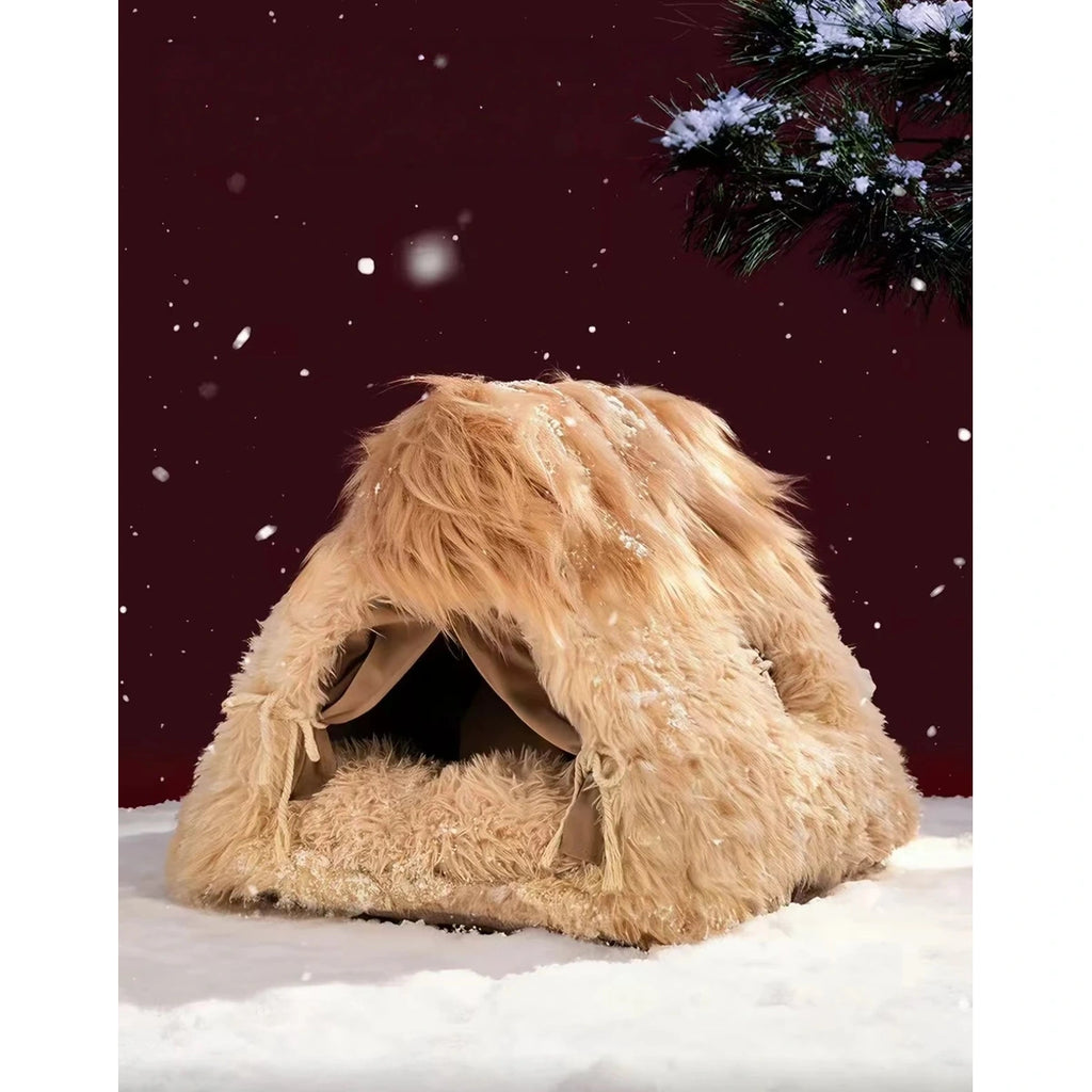 Petstar shaggy cat cave bed in a winter-themed setting